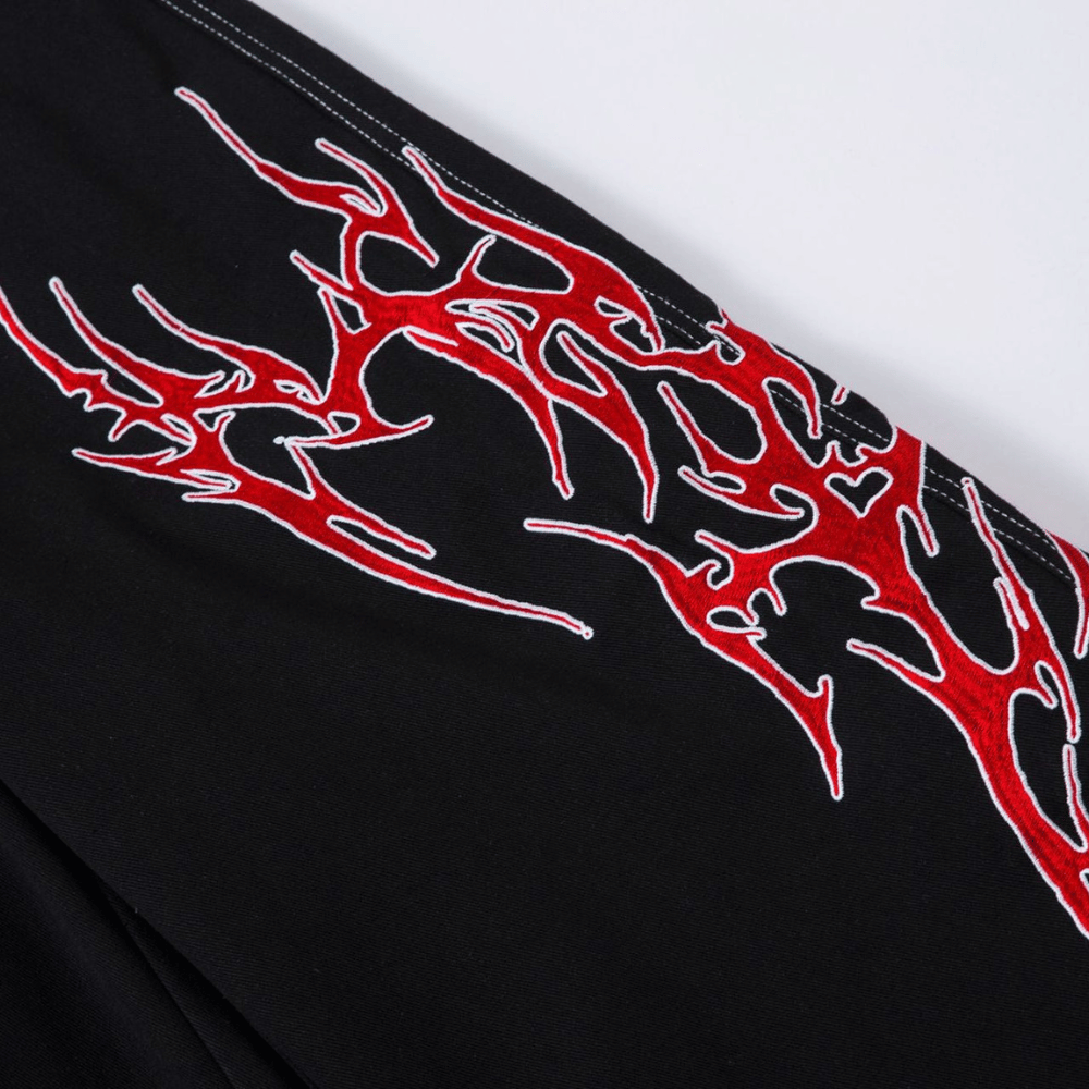 Embroidered Jeans with Tribal Flame Design