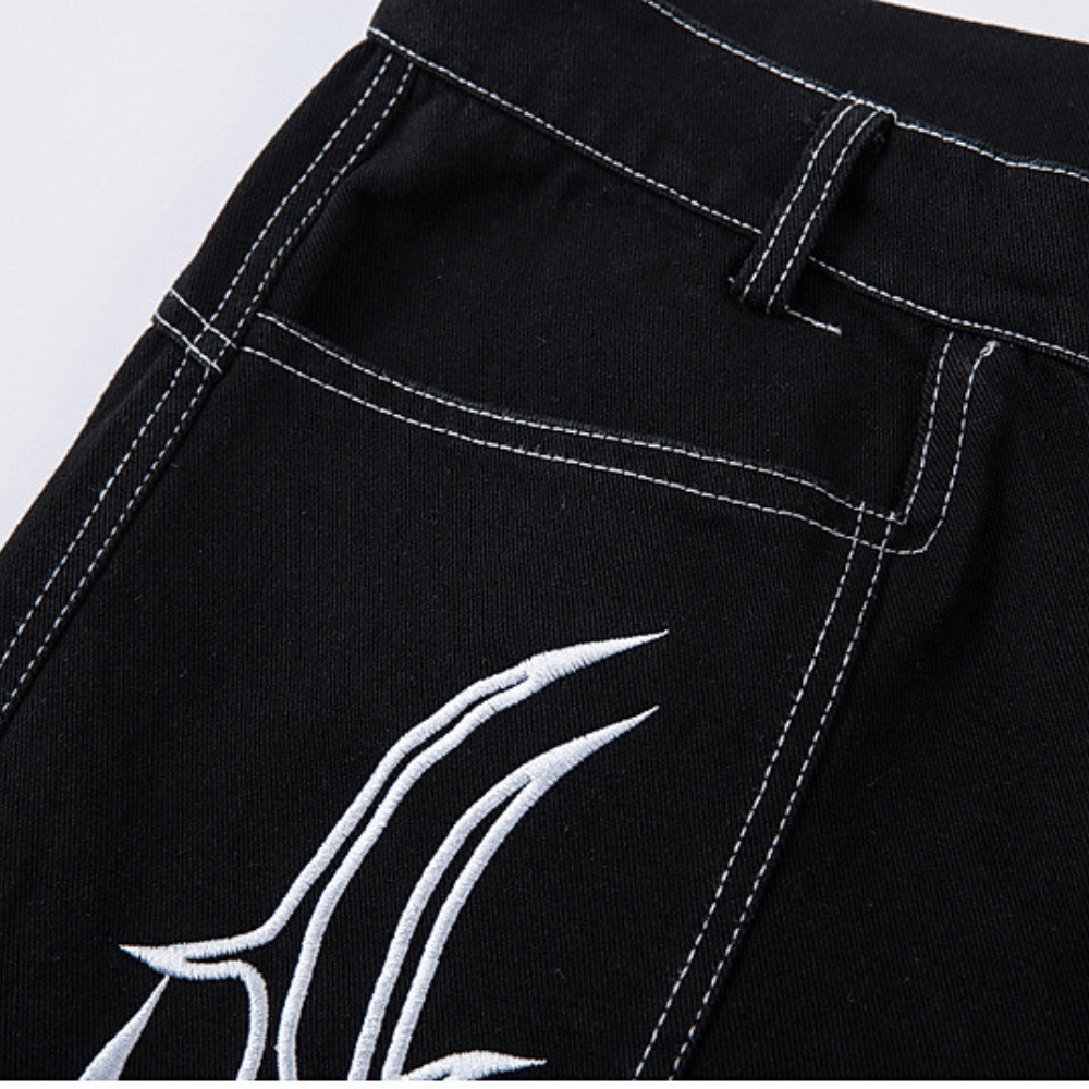 Baggy Embroidered Jeans with White Tribal Symbol Design