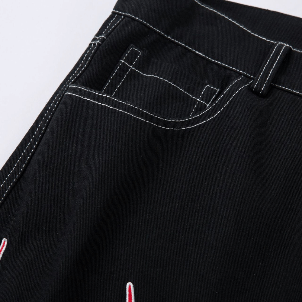 Embroidered Jeans with Tribal Flame Design